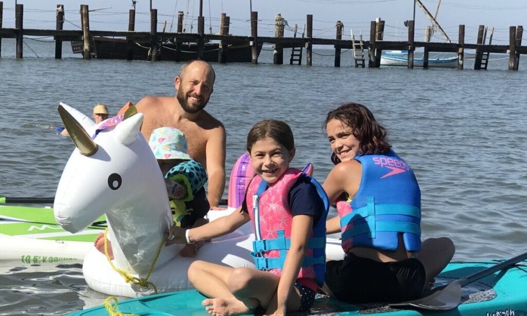 A family enjoys water fun at China Camp Beach.